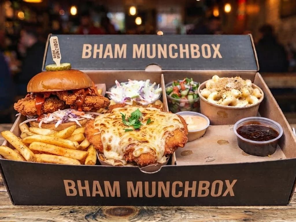 Bham Box - a cheese-topped parmo, a fried chicken burger, fries, slaw, salad and dips in one branded box, from Ashville Hot Chicken, JLT Dubai