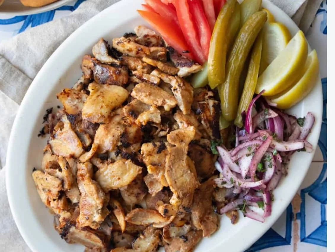 Chicken Doner Tray - a plate of sliced chicken doner with tomato, pickles, red onion and bread, from Ashville Hot Chicken, JLT Dubai