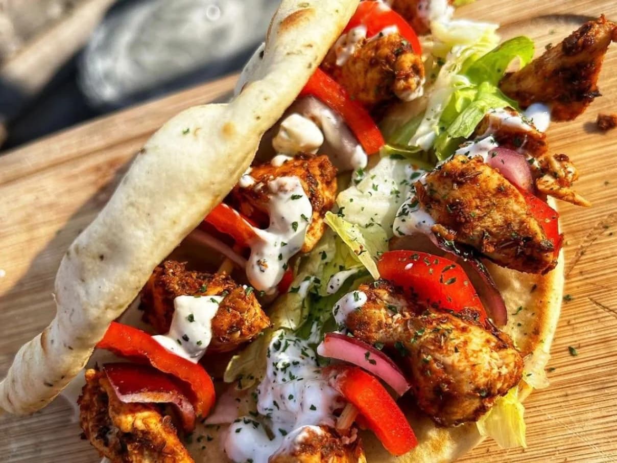 Chicken Shish Kebab - charcoal grilled chicken skewers with peppers, salad and garlic sauce on a flatbread, from Ashville Hot Chicken, JLT Dubai