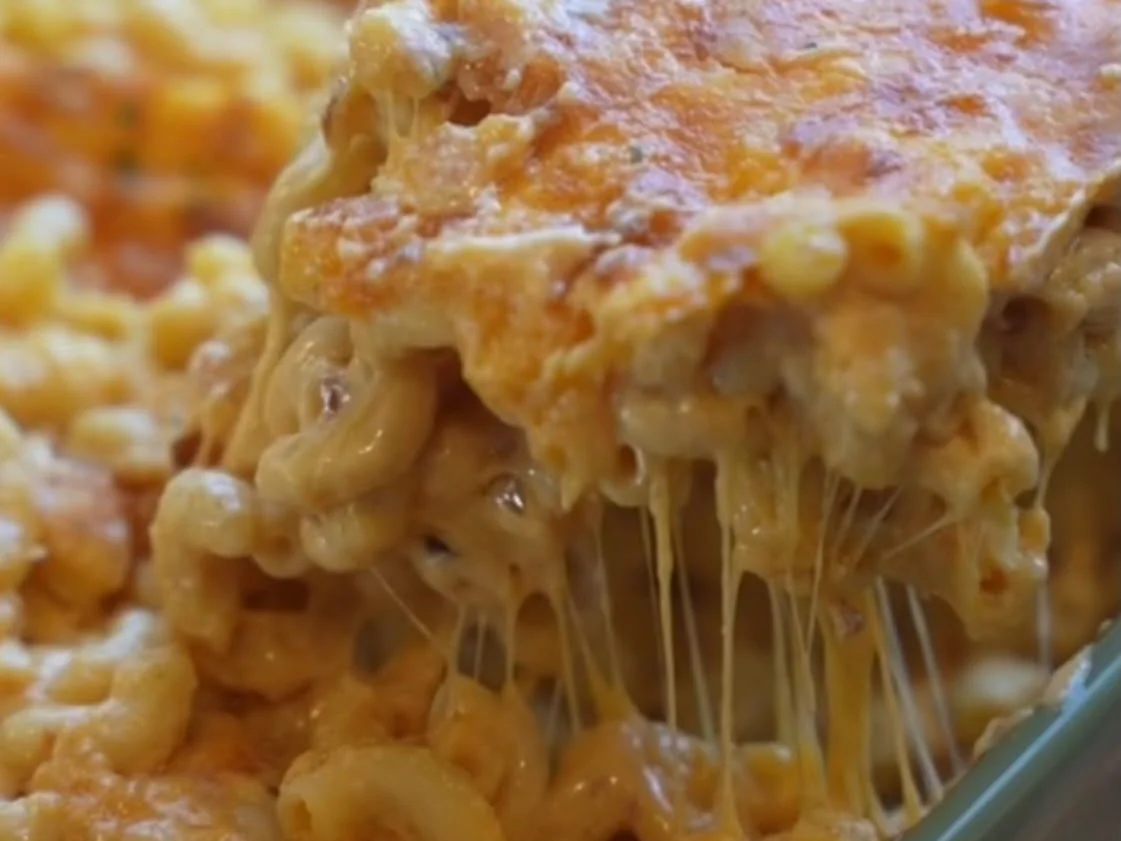 Mac Daddy - a slab of baked mac and cheese lifted from the dish with a long cheese pull, from Ashville Hot Chicken, JLT Dubai