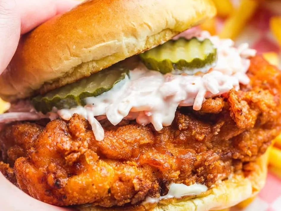 Nasty Nashville - Nashville hot fried chicken burger with slaw and pickles, held over a basket of fries, from Ashville Hot Chicken, JLT Dubai
