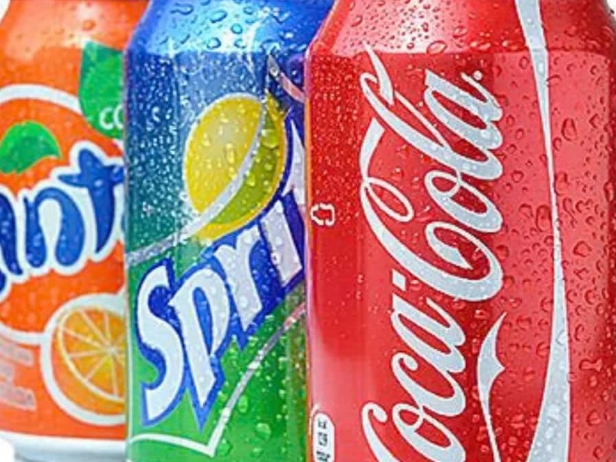 Soft Drinks - three chilled cans beaded with condensation, from Ashville Hot Chicken, JLT Dubai